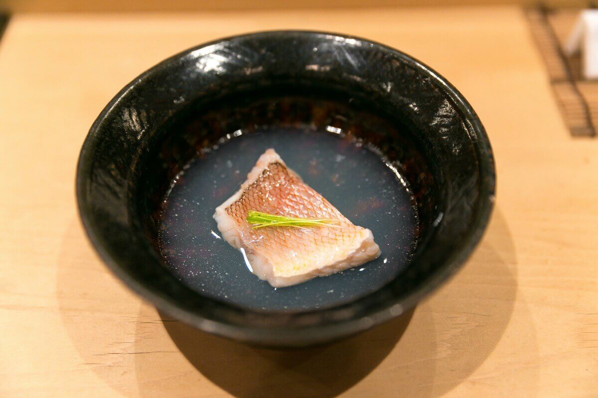 tile fish in clam soup at Harutaka in Tokyo, Japan